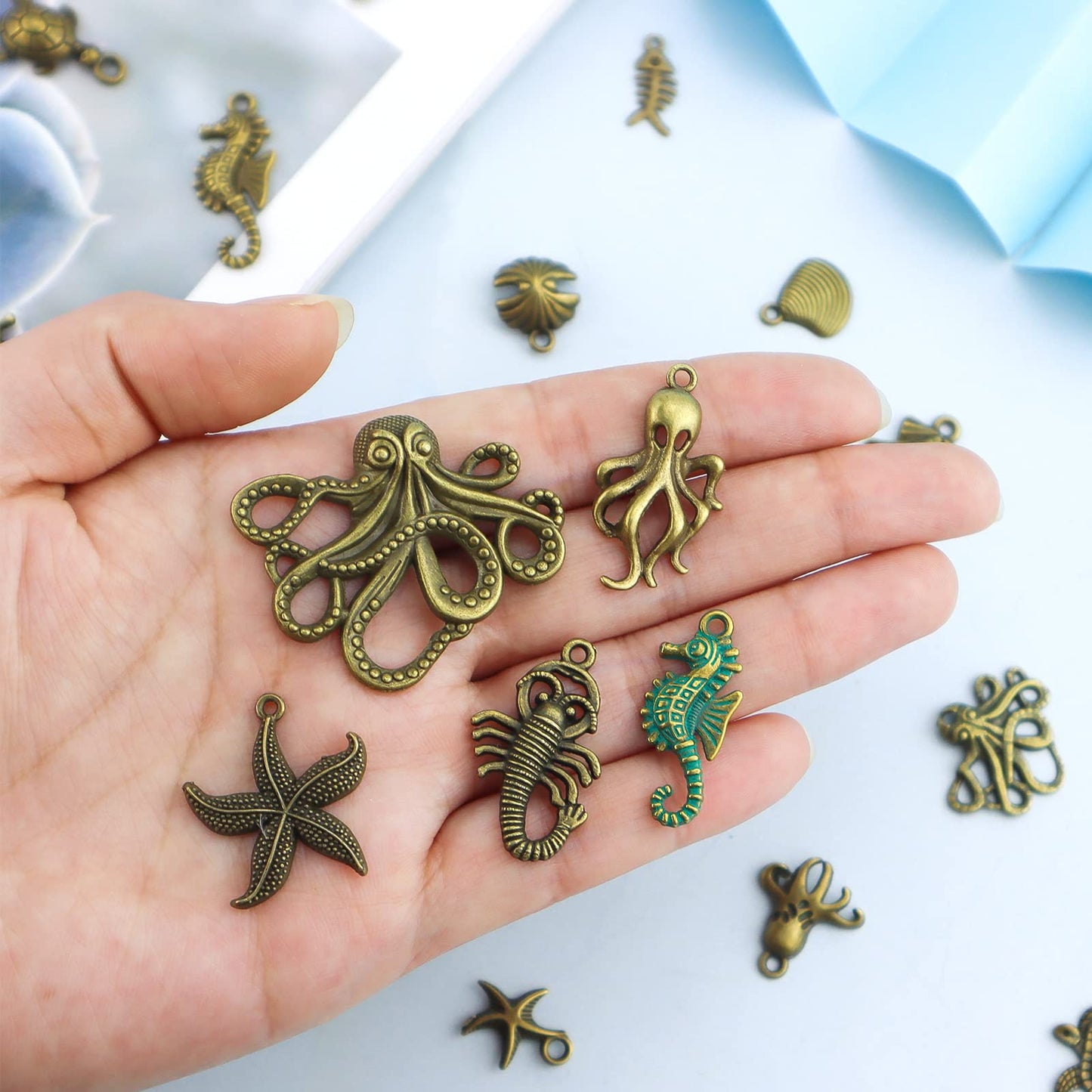 JIALEEY 100 Gram Assorted Antique Ocean Themed Charms Bronze Ocean Fish Sea Creatures Beads Pendants for Jewelry Making and Craft Making
