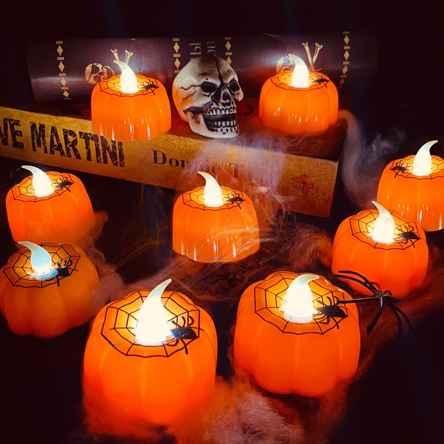 TURNMEON 12 Pack Halloween Pumpkin Tealights Candles with Spider Web Decor, LED Pumpkin Lights, Flame Less Candle Battery Operated Halloween Table Decorations Home Fireplace Party Thanksgiving Fall